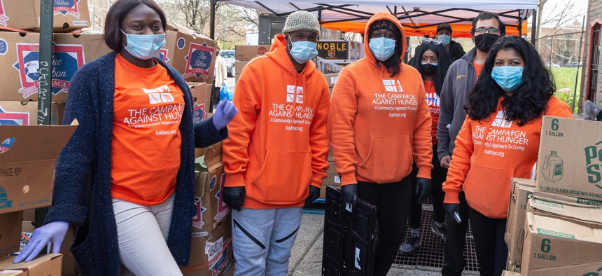 Workers at a food pantry by The Campaign Against Hunger during the COVID-19 pandemic in Brooklyn.