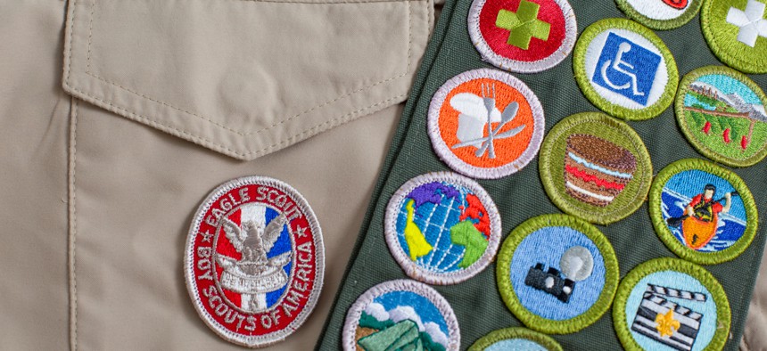 Eagle patch and merit badge sash on Boy Scouts of America uniform.