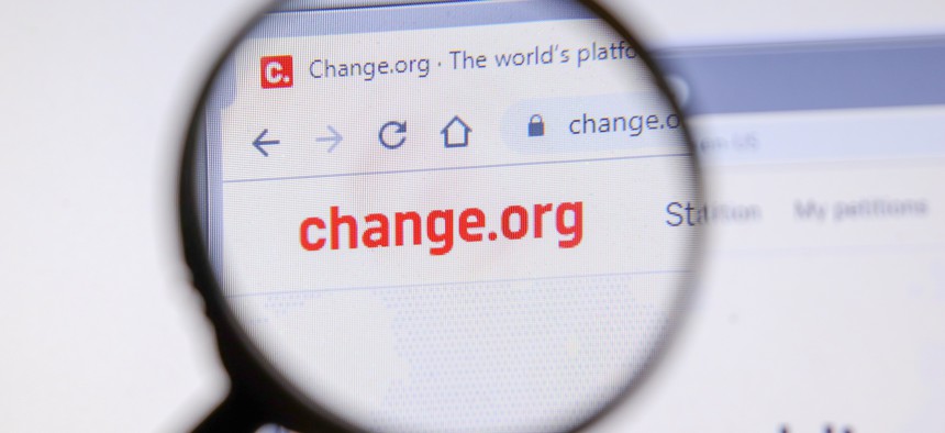 Change.org website displayed on screen.