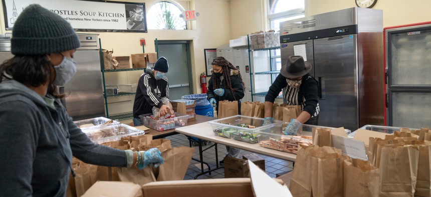 Volunteers prepare food bags at Holy Apostles Soup Kitchen in New York City.