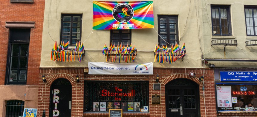 The stonewall inn is in between two buildings.