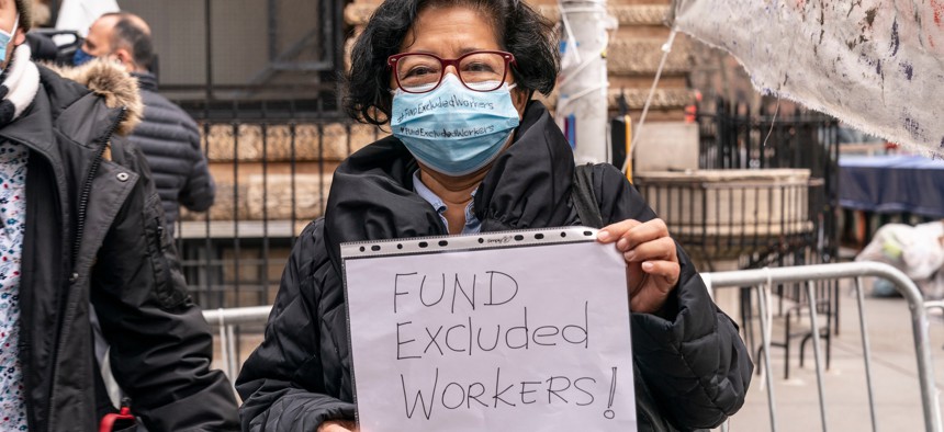 People rallying in support of the Excluded Workers Fund in March.