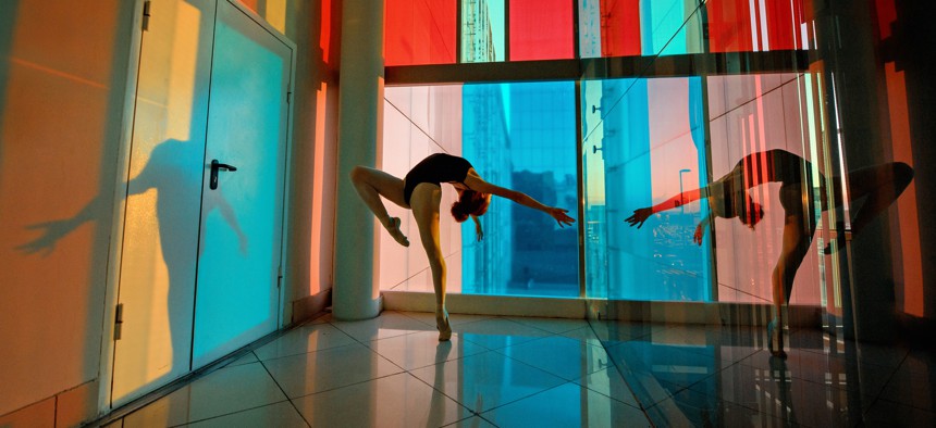 Female dancer in colorful studio in city.