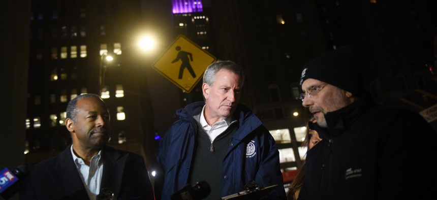 Mayor Bill de Blasio, U.S. Housing and Urban Development Secretary Ben Carson and the New York City Department of Homeless Services Commissioner Steven Banks.