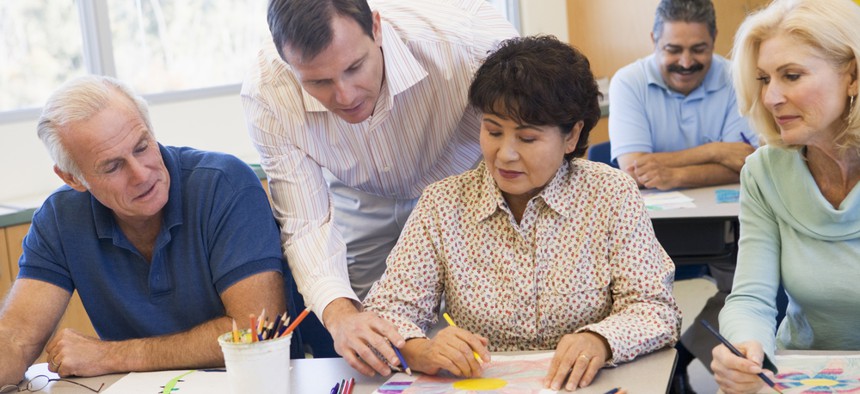 Adults sitting in an art classroom