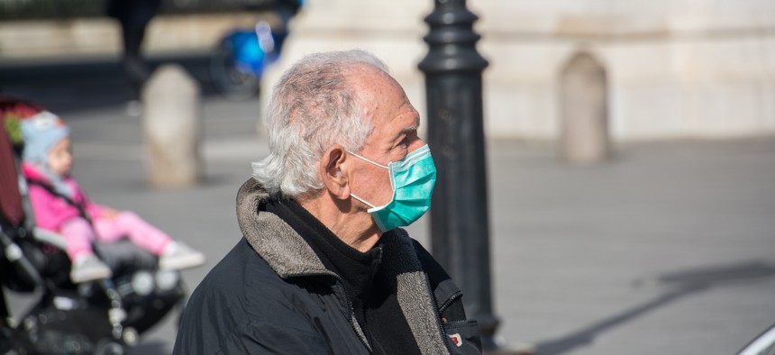 Older man wearing a mask in New York City. 