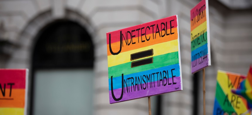 A pride-themed sign which says undetectable = untrasmittable