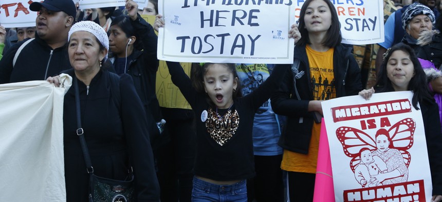 people at a midtown Manhattan protest against Trump administration immigration policy