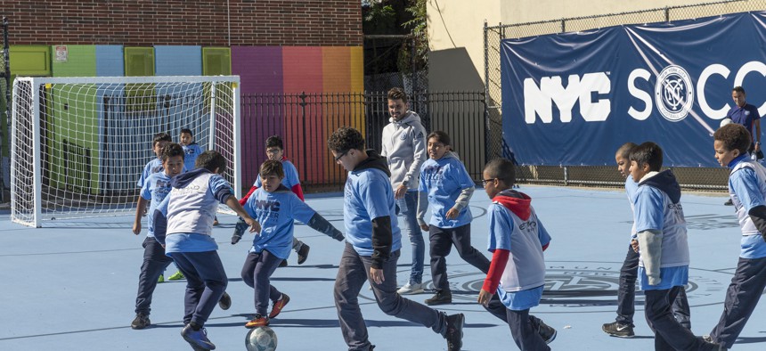 Children at New York City PS 83/PS 182 in Harlem playing soccer in 2017.