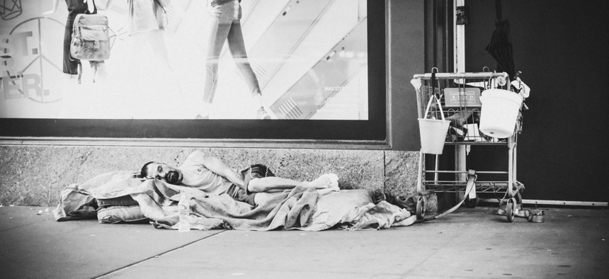 A sleeping homeless man.
