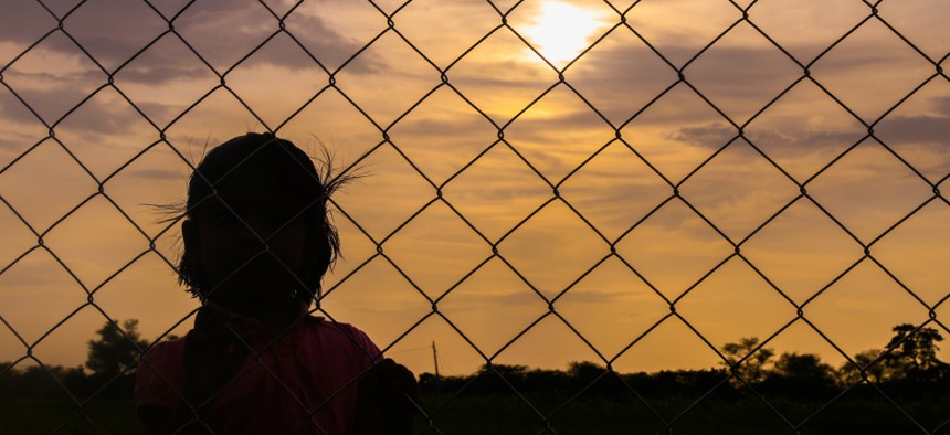 Child at a fence