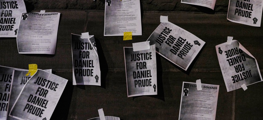 Notices reading "Justice for Daniel Prude" are pasted on the exterior walls of Rochester City Hall in protest of the police killing of Daniel Prude.
