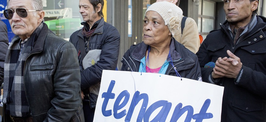 Local residences listen to state Attorney General Letitia James speak at a press conference to support rent controlled tenants threatened with eviction on March 13, 2019 in Manhattan's East Village neighborhood.
