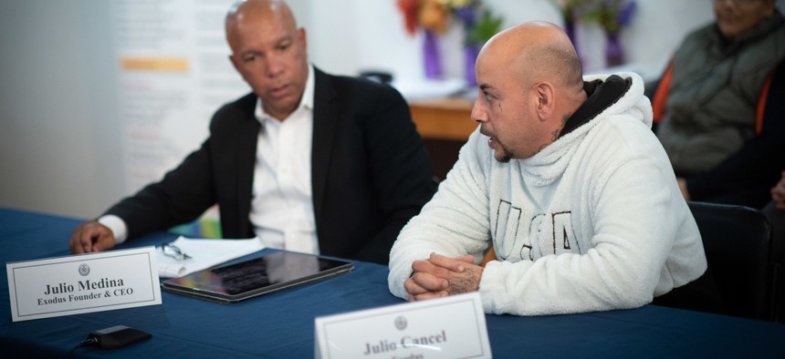 Exodus Transitional Community founder Julio Medina speaks with Julio Cancel, a formerly incarcerated person, during a criminal justice related roundtable at the nonprofit's office in East Harlem in 2019.