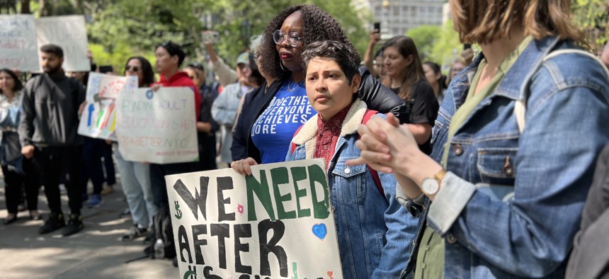  New York City Council Member Althea Stevens (center), chair of the youth committee, and Dante Bravo, youth policy analyst at United Neighborhood Houses, participate in a rally protesting cuts to youth services in City Hall Park on May 10, 2023.