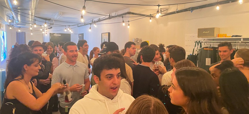 A crowd attends the Sunflower Network's pop-up fundraiser in Brooklyn on Thursday