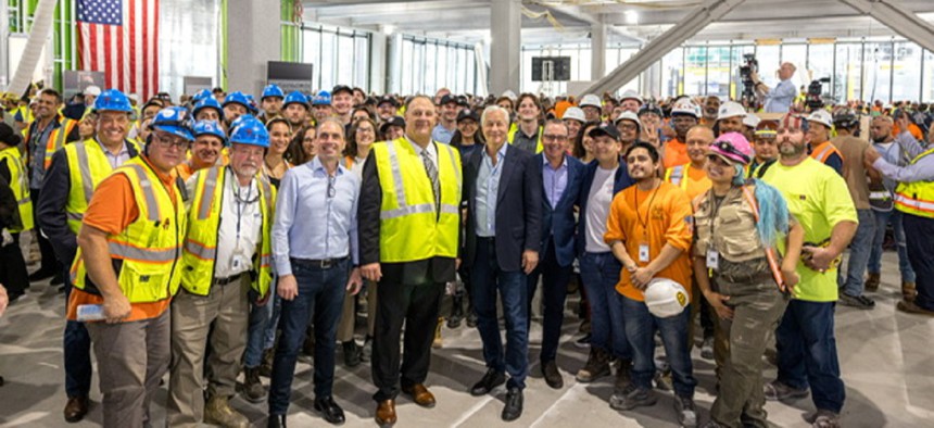 JPMorgan Chase CEO Jamie Dimon (center) with Gary LaBarbera, president of the Building and Construction Trades Council of Greater New York (left of center) visit 270 Park Ave., the bank's new global headquarters under construction in midtown Manhattan. 