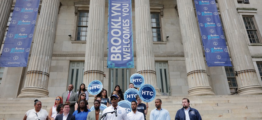 New York Mayor Eric Adams addresses the media at a rally in support of asylum seekers on Aug. 15, 2023.