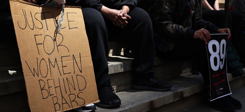 Members of the Women's Community Justice Association holding a rally calling for better conditions at the Rose M. Singer Center for women, also known as Rosie's, at the Rikers Island jail complex on April 26, 2021.