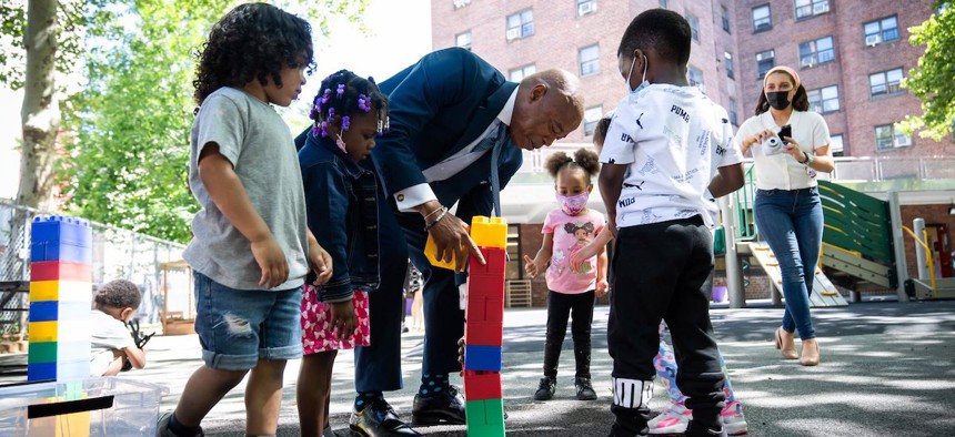 New York City Mayor Eric Adams enjoys play time at Union Settlement Union Carver Center in Manhattan last year at the announcement of his administration’s “blueprint” for child care and early childhood education. The city, through a partnership with the Robin Hood Foundation, is now expanding access to its child care voucher program. 