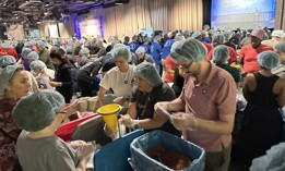 Volunteers packed the Intrepid Sea, Air & Space Museum Monday for the 9/11 Day Meal Pack campaing on Monday