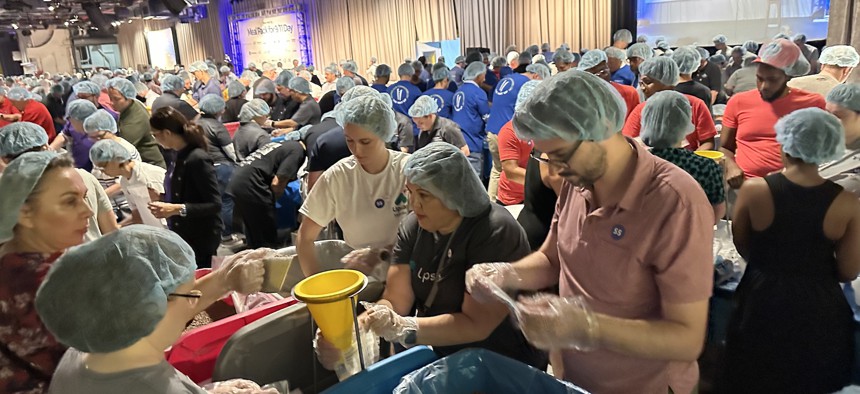 Volunteers packed the Intrepid Sea, Air & Space Museum Monday for the 9/11 Day Meal Pack campaing on Monday