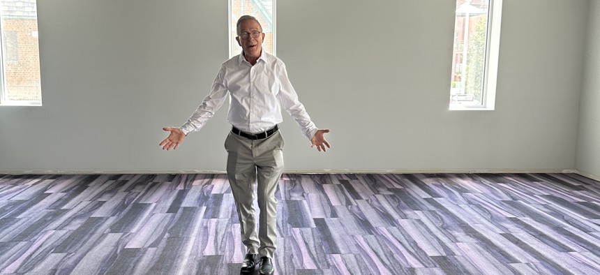 Todd Fliedner, executive director at the Bay Ridge Senior Center, shows a newly carpeted room inside the center's new building at 15 Bay Ridge Ave.