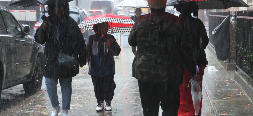 People walk under umbrellas amid heavy rain on September 29, 2023 in New York City.