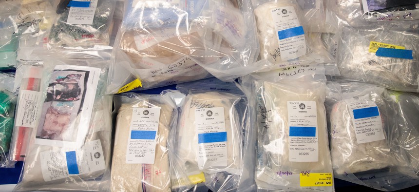 Bags of heroin are displayed at a press conference announcing a major drug bust, at the office of the New York Attorney General on September 23, 2016.