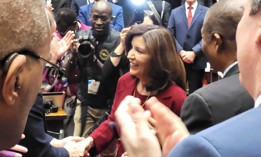 Gov. Kathy Hochul greets lawmakers before delivering her 2024 State of the State address.