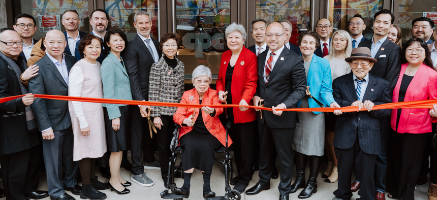Virginia Kee, co-founder of CPC, cuts the ribbon on the nonprofit’s new CPC One community center Friday