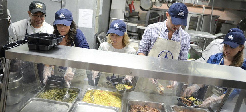  Cameron Adams, cofounder of design software maker Canva, along with actors Patti Murin and Andrew Rannells join in preparing meals for Citymeals on Wheels at  at Encore Community Services on September 24, 2015.