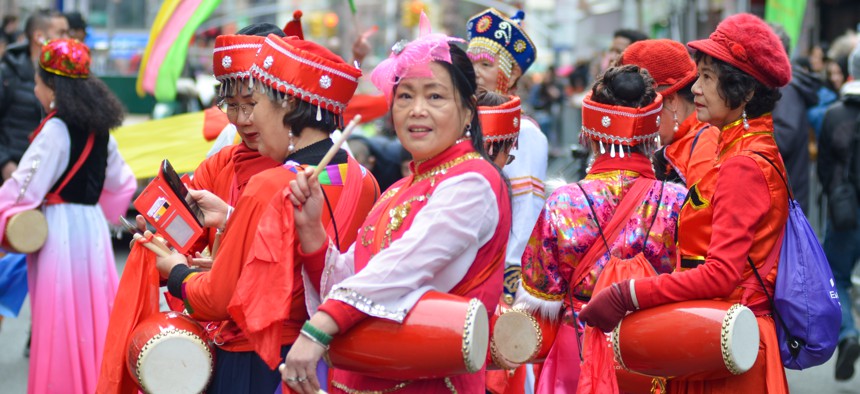 Marchers in traditional Chinese costumes during the annual Chinese New Year Parade in Lower Manhattan.