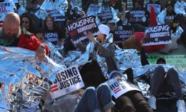 Die-in demonstration by organizers and housing advocates on the steps of the U.S. Supreme Court as oral arguments are heard in Pass v. Johnson on April 22, 2024. 