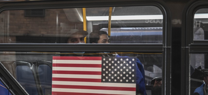 A bus with migrants from the southern border arrives at New York City’s Port Authority Bus Terminal.