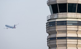 An American Airlines Airbus A321 airplane takes off past the air traffic control tower at Ronald Reagan Washington National Airport in Arlington, Va. A coming oversight report examines the use of legacy technology in Federal Aviation Administration operations.