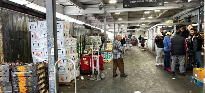 Buyers and sellers haggle over prices of produce and more at Hunts Point.