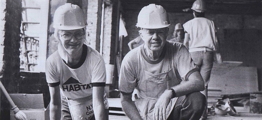 Former President Jimmy Carter and former First Lady Rosalynn Carter at the construction of Mascot Flats, the first building built by volunteers working for Habitat for Humanity in Sept. 4, 1984.